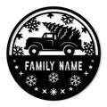 Round Christmas metal sign featuring a vintage pickup truck carrying a Christmas tree and snowflake accents