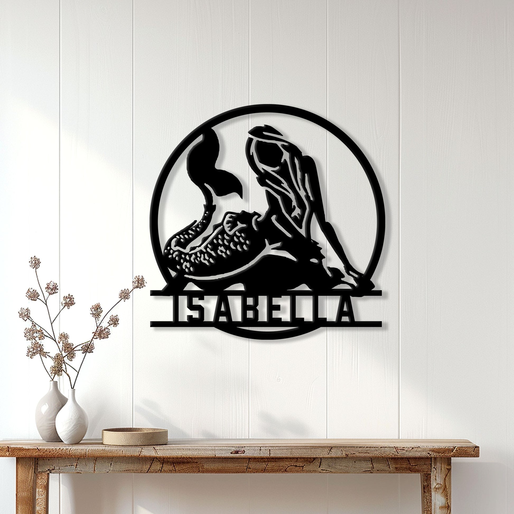 Mermaid wall sign displayed on a light paneled wall above a console table