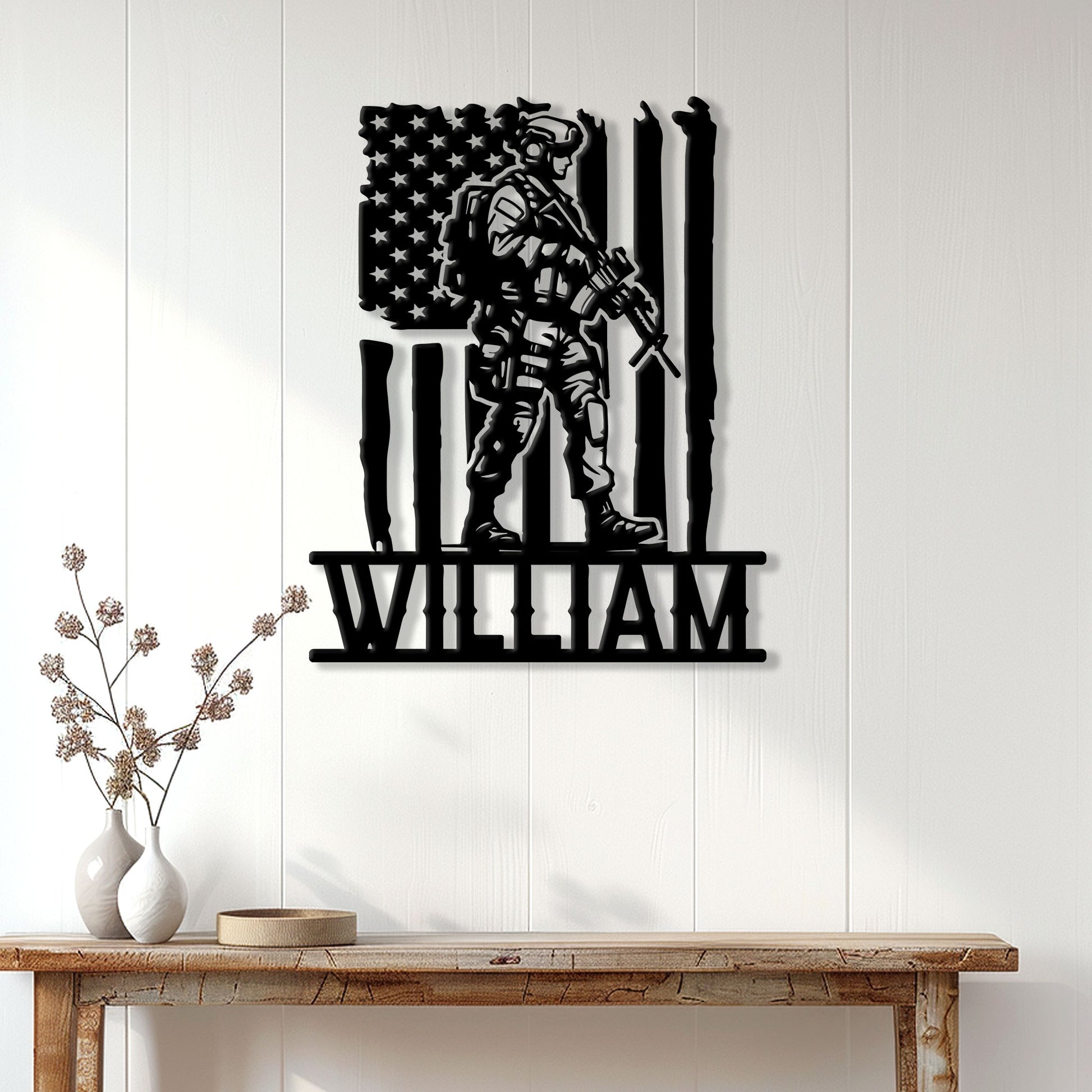 Black veteran wall sign displayed on a light paneled wall above a rustic console table