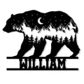 Bear-shaped metal sign featuring a mountain, pine forest, crescent moon, and starry night silhouette