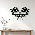 Checkered racing flags metal sign displayed on a white paneled wall above a console table