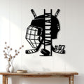 Hockey goalie metal wall sign displayed on a light paneled wall above a rustic console table