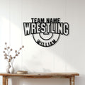 Wrestling team wall decor displayed above a console table in a bright modern home