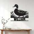 Mallard duck hunting wall sign displayed on a light paneled wall above a rustic console