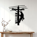 Lineman metal wall sign displayed on a light wood-paneled wall above a console table