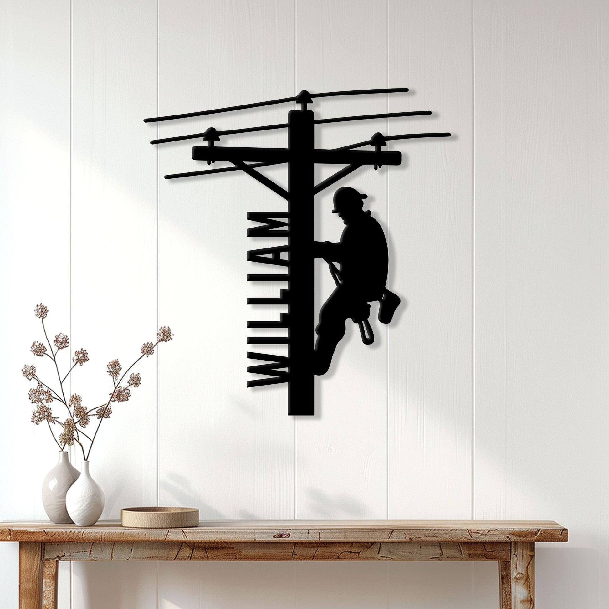 Lineman metal wall sign displayed on a light wood-paneled wall above a console table