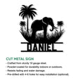 Elephant metal wall sign featuring a tropical palm tree silhouette and bold wildlife design