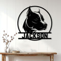 Custom pitbull wall sign displayed above a console table in a bright modern entryway