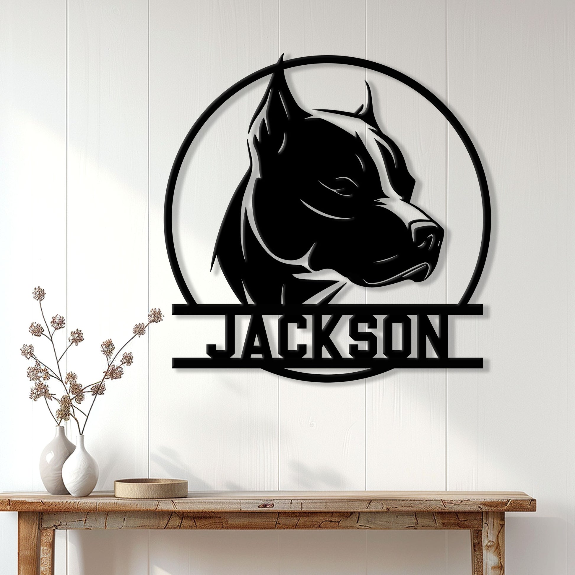 Custom pitbull wall sign displayed above a console table in a bright modern entryway