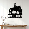 Barrel racer metal wall sign displayed on a bright paneled wall above a console table