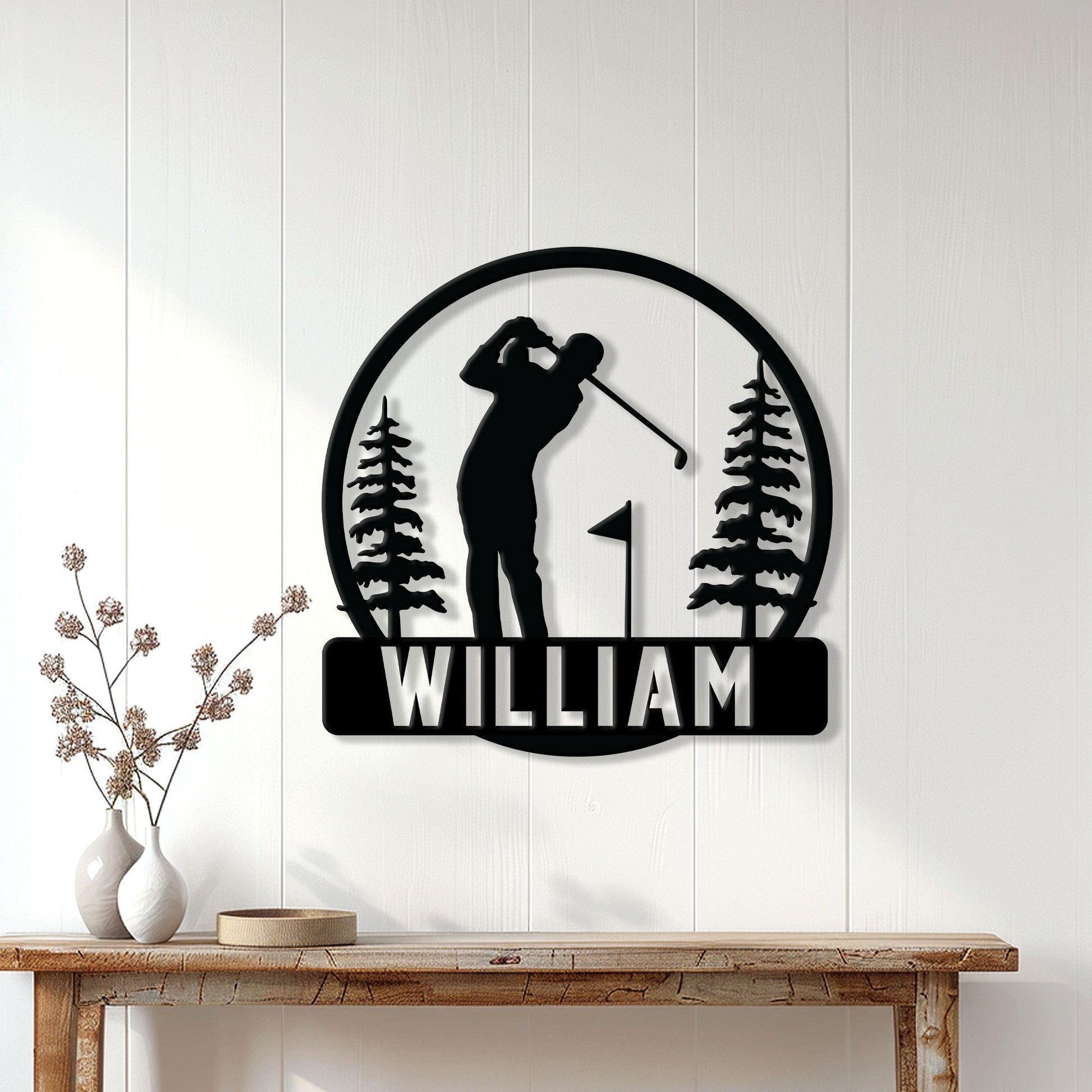 Golf wall decor displayed above a console table, featuring a golfer silhouette in a pine forest