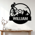 Mountain biker wall sign displayed above a console table in a bright modern home