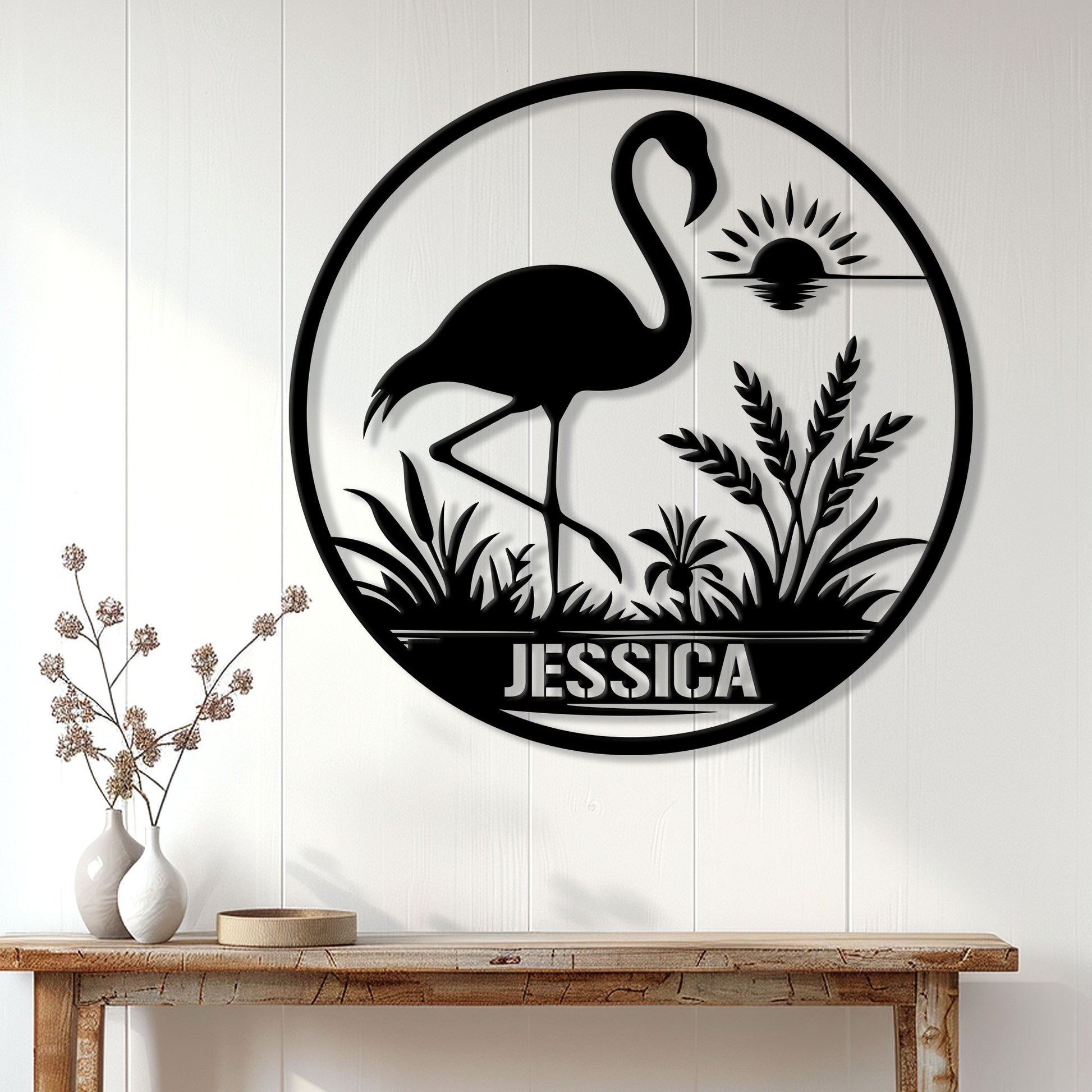 Black flamingo silhouette wall sign displayed above a console table in a bright modern entryway