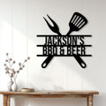 Black BBQ metal sign displayed on a light paneled wall above a rustic console table