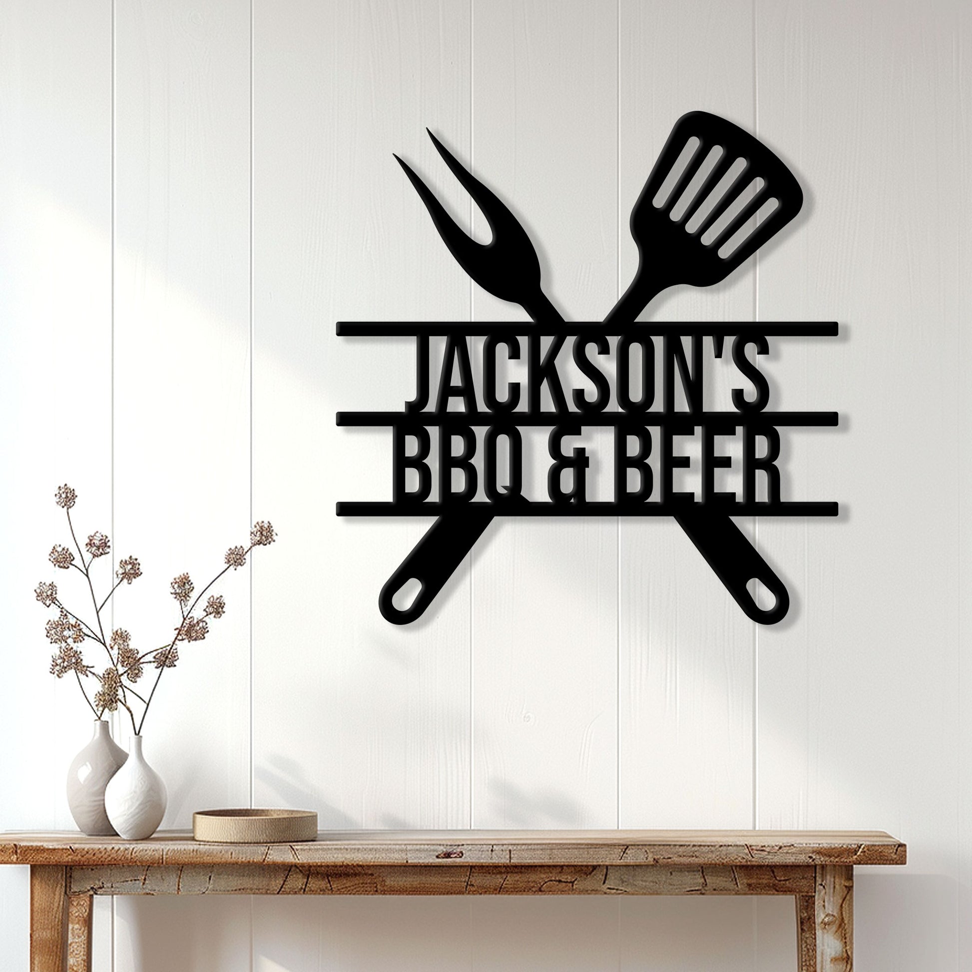 Black BBQ metal sign displayed on a light paneled wall above a rustic console table