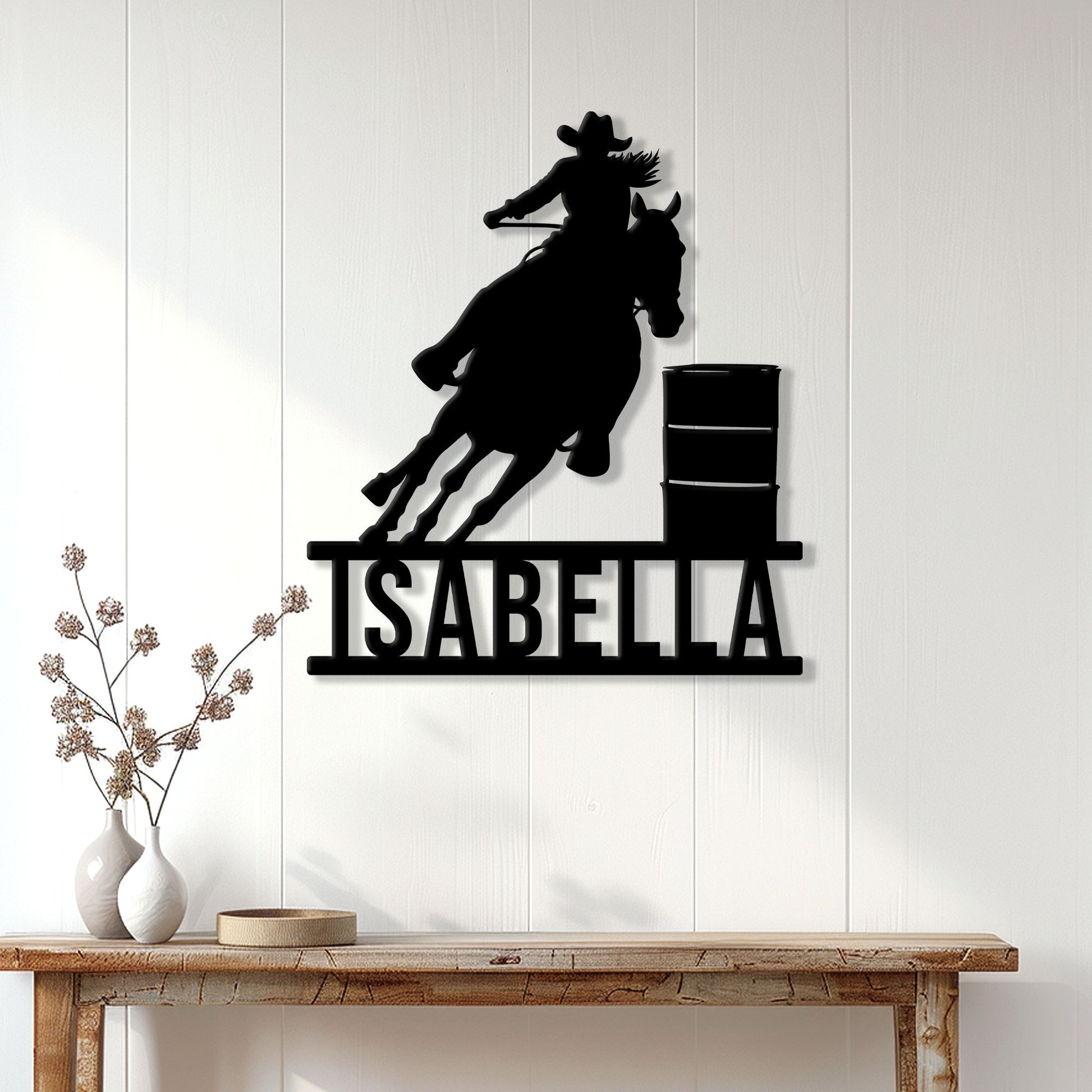 Barrel racing horse and rider silhouette metal sign displayed on a white paneled wall