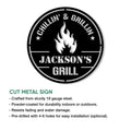 Black cut metal BBQ sign featuring a flame emblem and circular grill-themed design