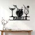 Black cocktail wall sign displayed above a console table in a bright home bar setting