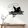 Black cowboy roping a horse displayed as Western wall decor in a bright home entryway