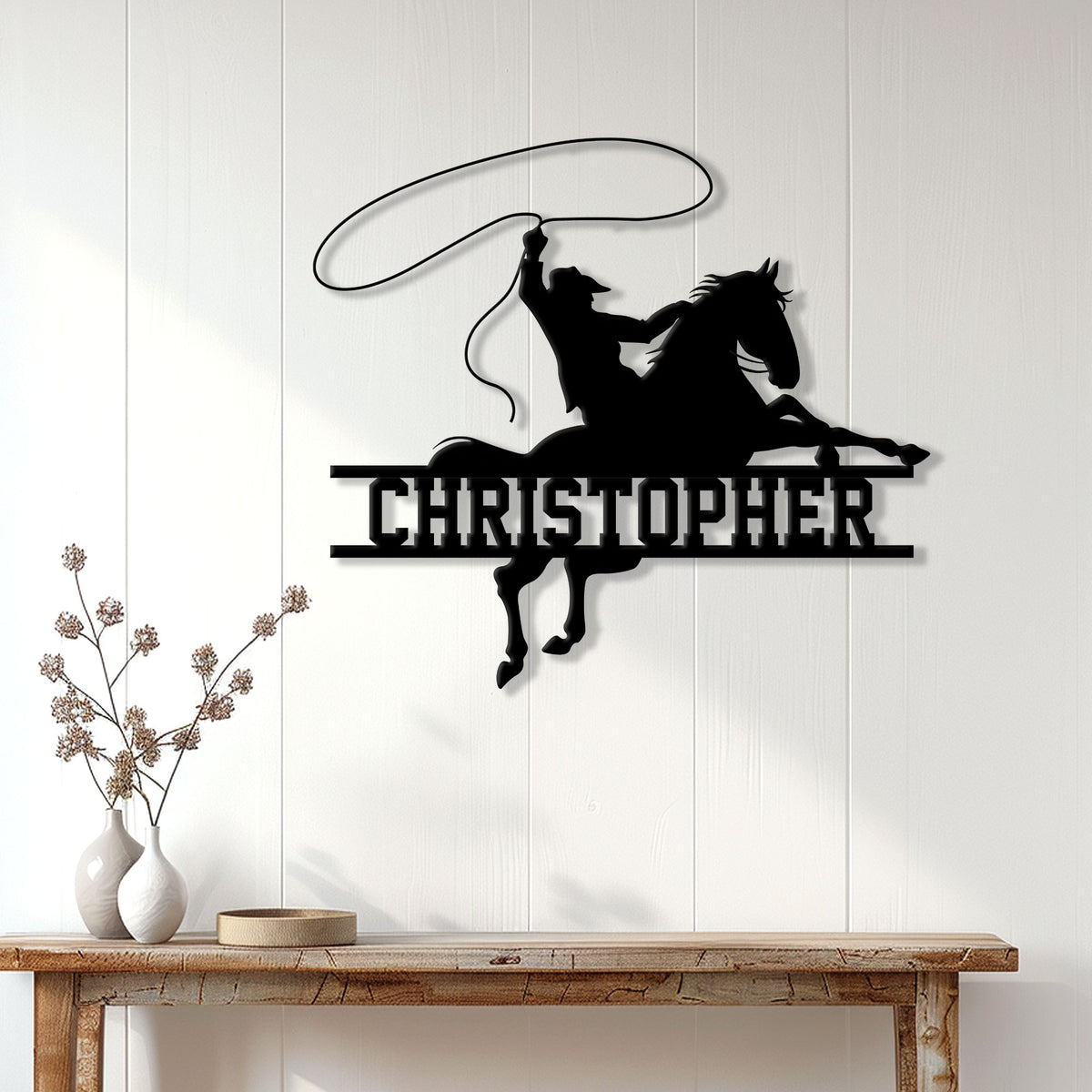 Black cowboy roping a horse displayed as Western wall decor in a bright home entryway