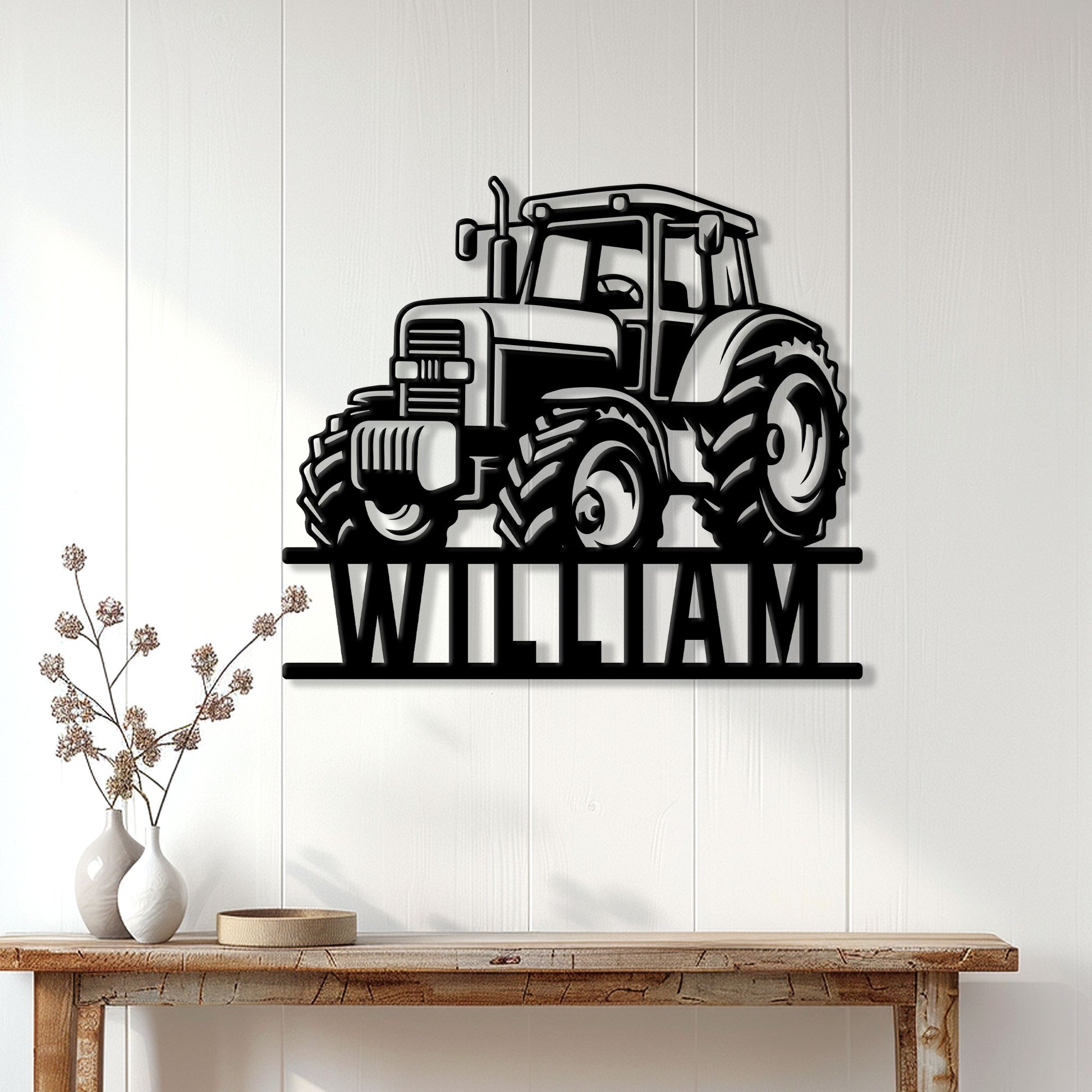 Black tractor metal sign displayed on a light paneled wall above a rustic console table