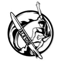 Black and white surfer riding a curling wave with a surfboard in a circular metal sign design