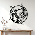 Surfer wall decor displayed on a white paneled wall above a wooden console table