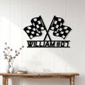 Crossed checkered flag racing sign displayed on a light paneled wall above a console table