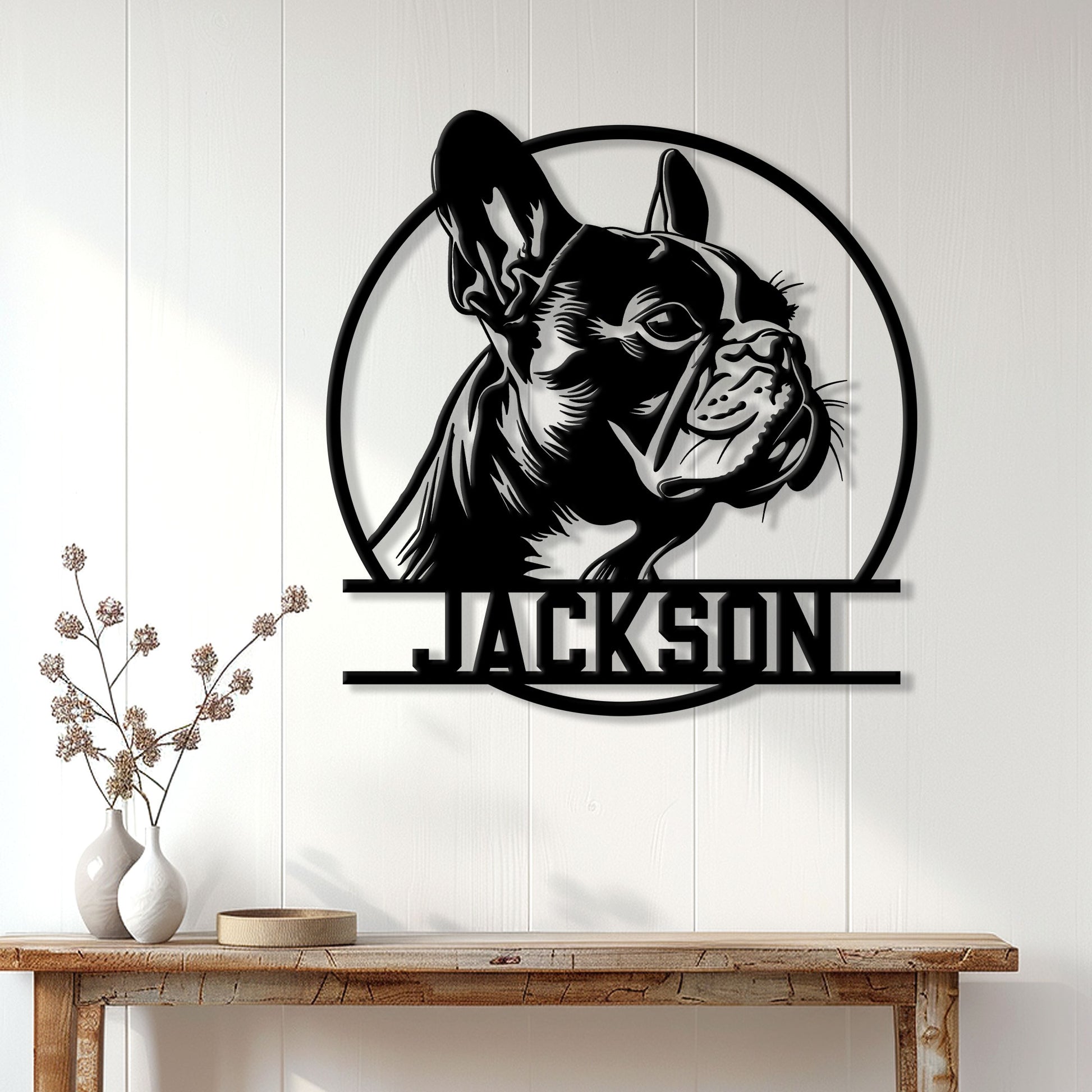 Frenchie metal wall sign displayed above a console table in a bright modern home