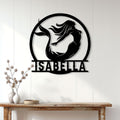 Mermaid wall sign displayed above a console table in a bright, modern home