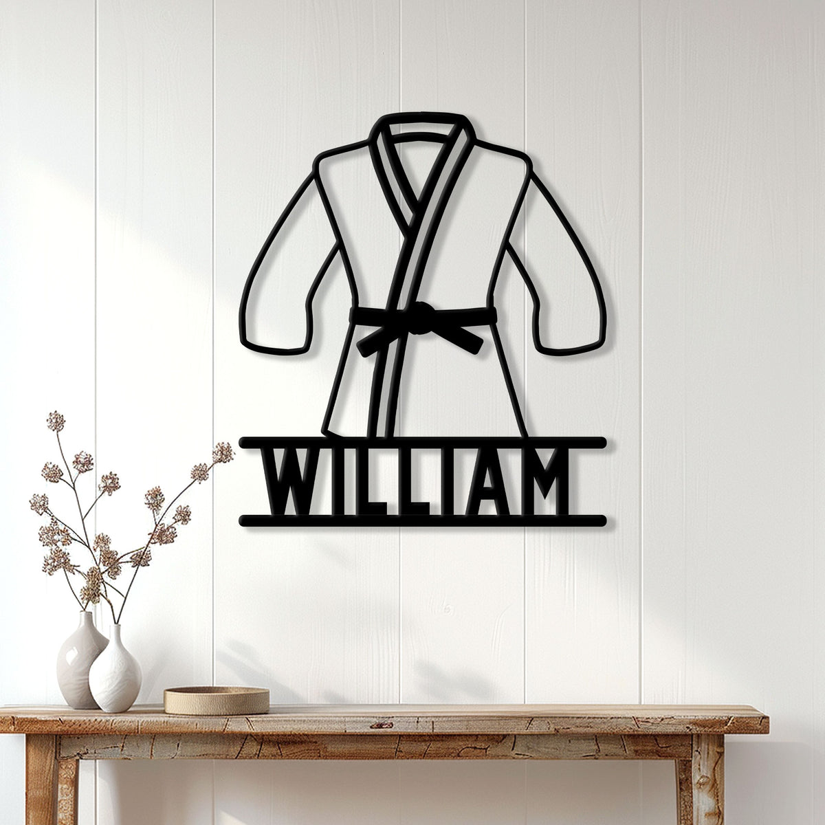 Brazilian jiu jitsu metal sign displayed on a white paneled wall above a console table