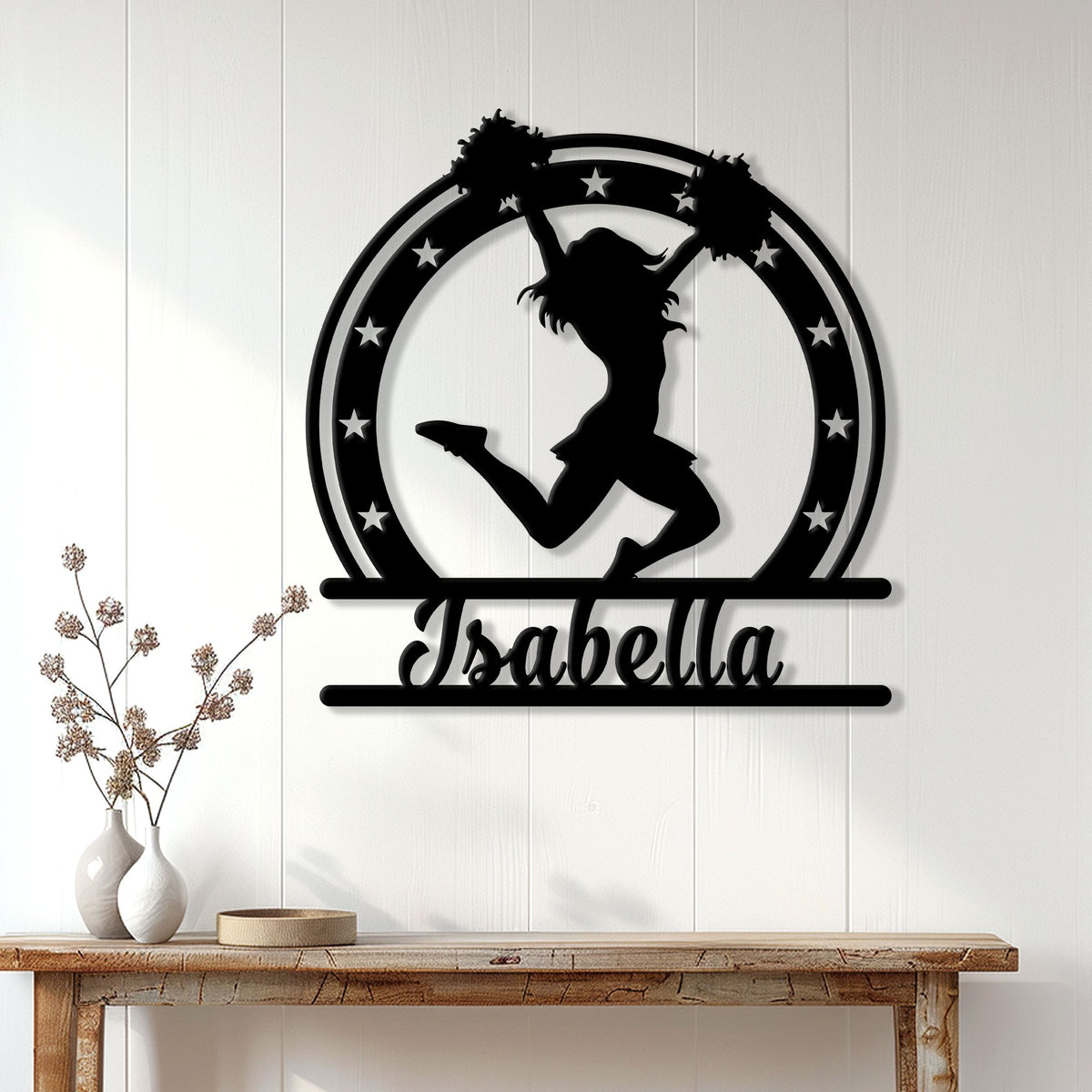 Cheerleader silhouette wall sign displayed above a console table in a bright home interior