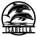 Circular dolphin metal sign featuring two dolphins leaping above stylized ocean waves