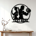 Gym wall decor displayed above a console table, featuring a couple working out in silhouette