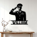 Saluting military servicemember metal sign displayed on a white paneled wall in a home entryway