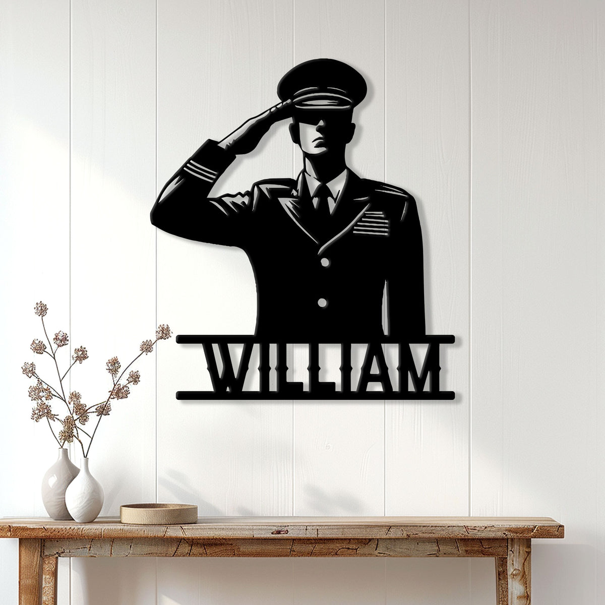 Saluting military servicemember metal sign displayed on a white paneled wall in a home entryway