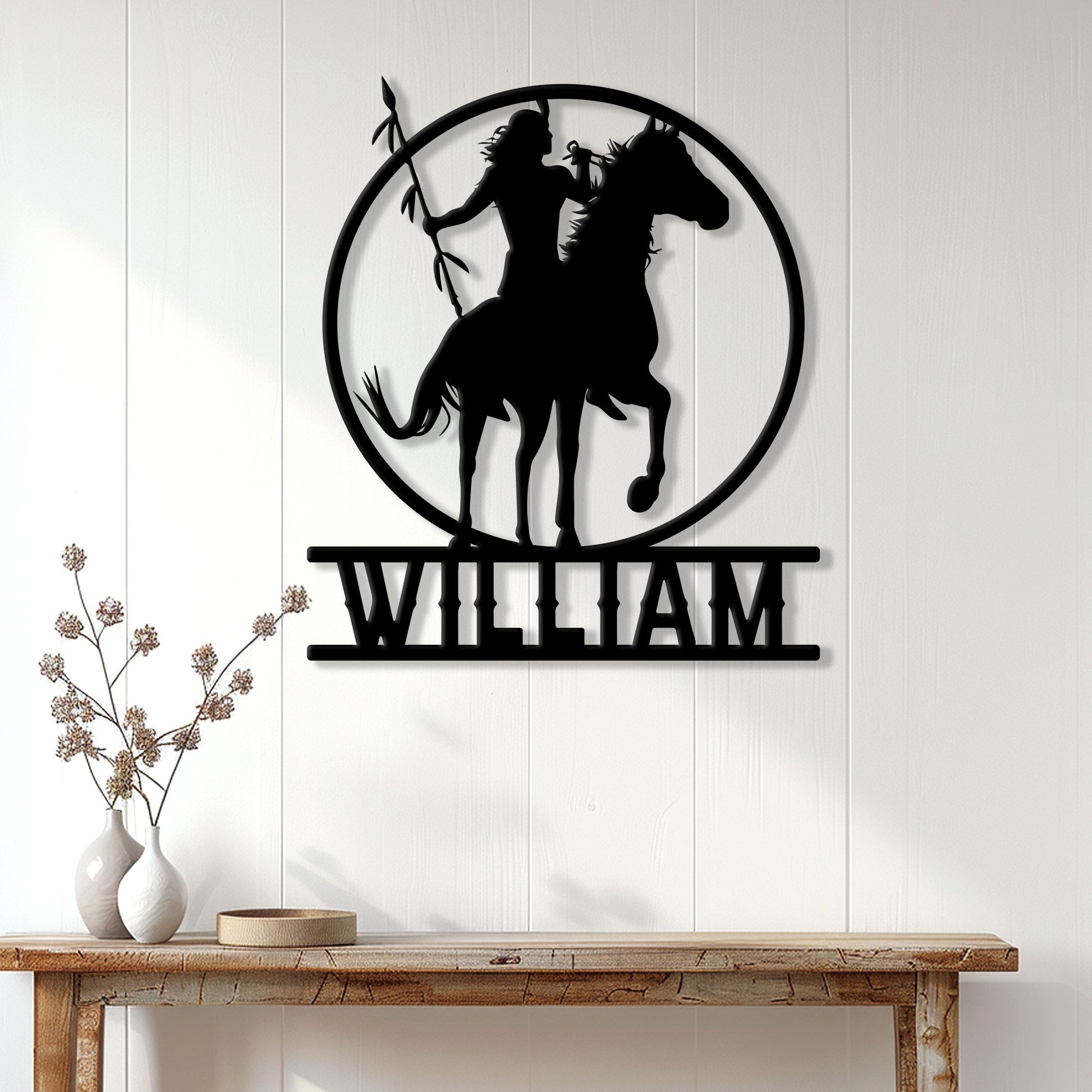 Native American horseback rider metal wall sign displayed on a light wood-paneled entryway wall