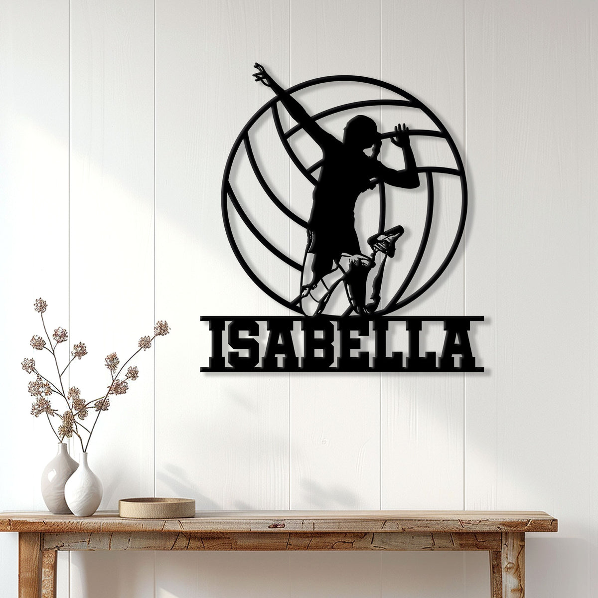 Volleyball player silhouette metal sign displayed as modern wall decor above a wooden console table