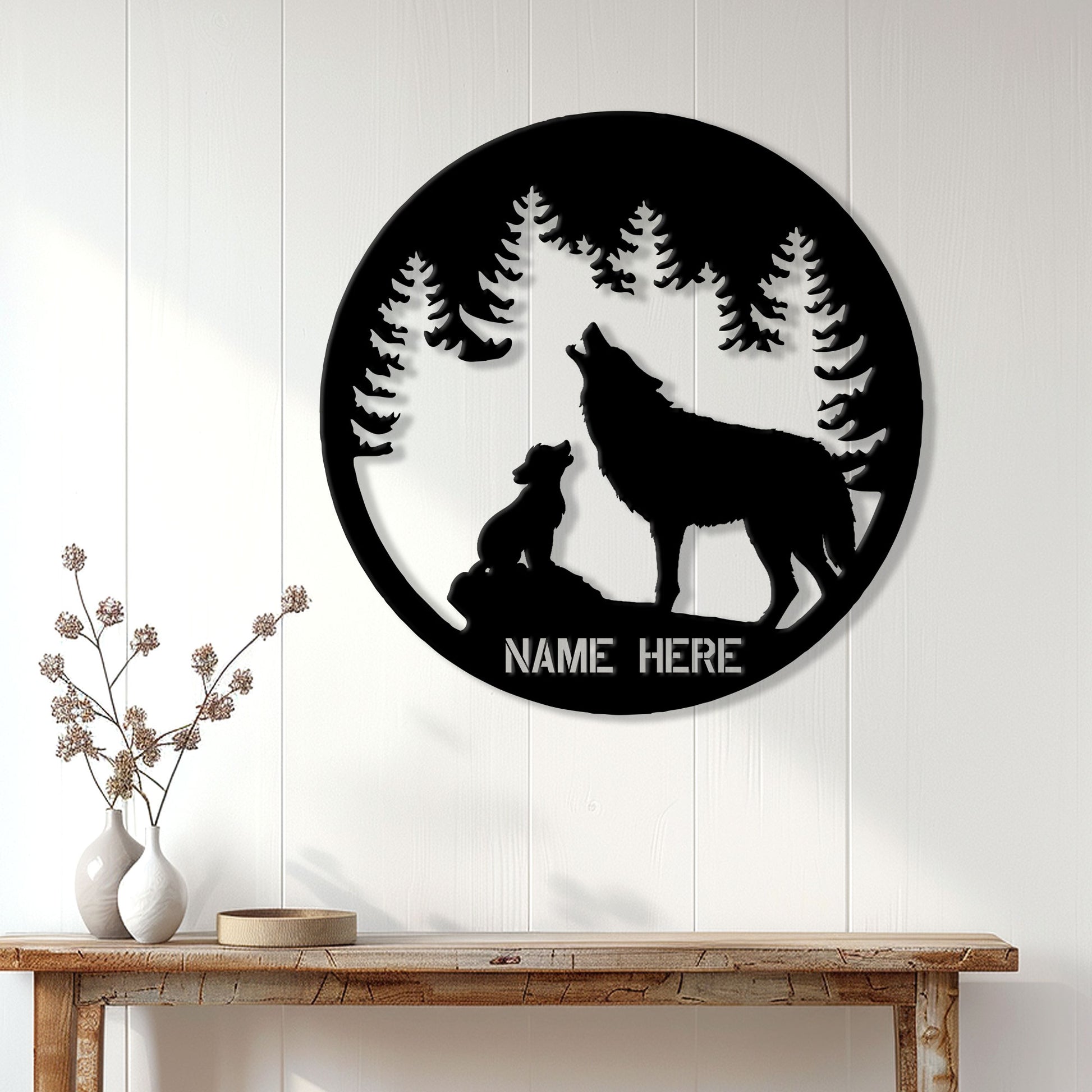 Wolf family metal wall sign displayed on a light wood-paneled wall above a console table