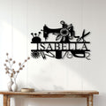 Sewing wall decor displayed above a console table, featuring a sewing machine and floral craft tools