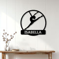 Black gymnastics silhouette metal sign displayed on a bright paneled wall above a console table