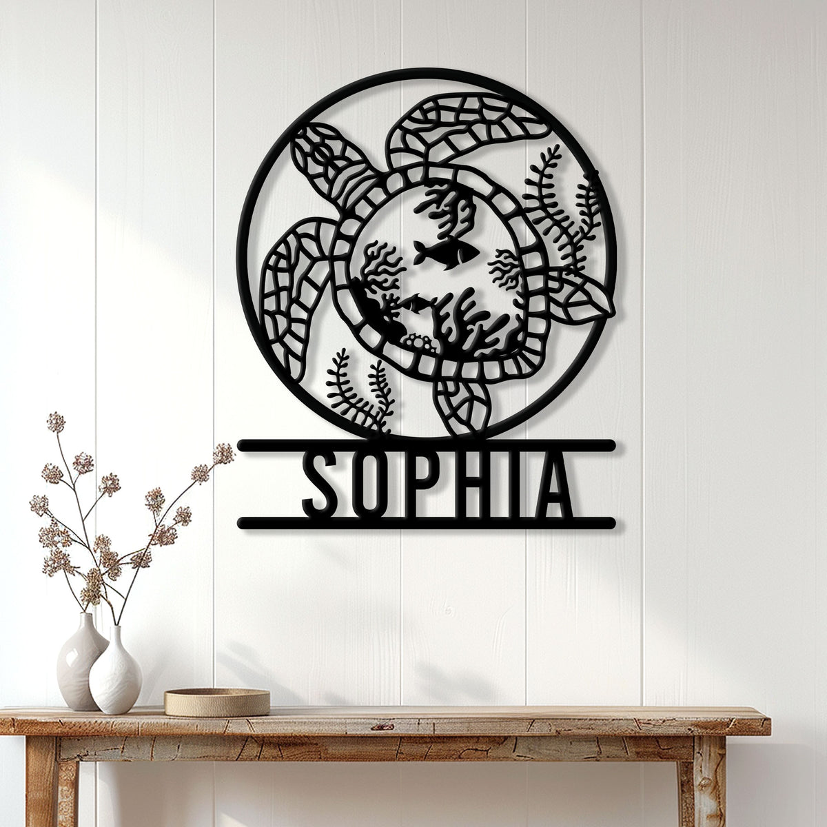 Sea turtle metal wall decor displayed on a light wood-paneled wall above a console table