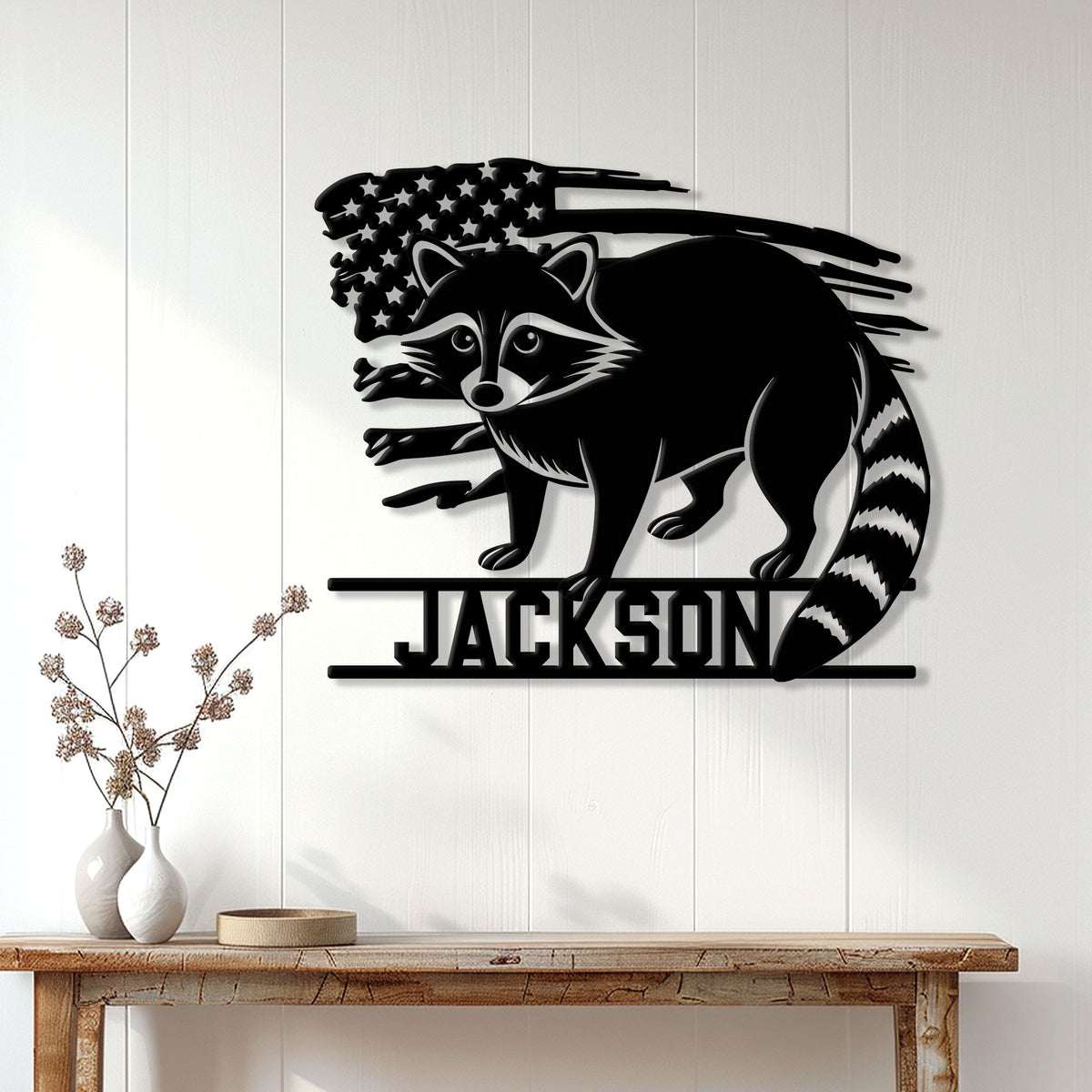 Custom raccoon wall sign displayed on a light wood-paneled wall above a console table