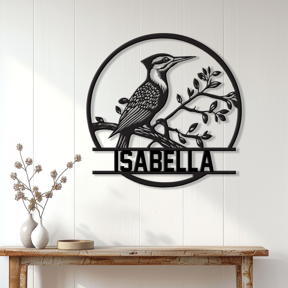Woodpecker wall sign displayed on a light paneled wall above a rustic console table