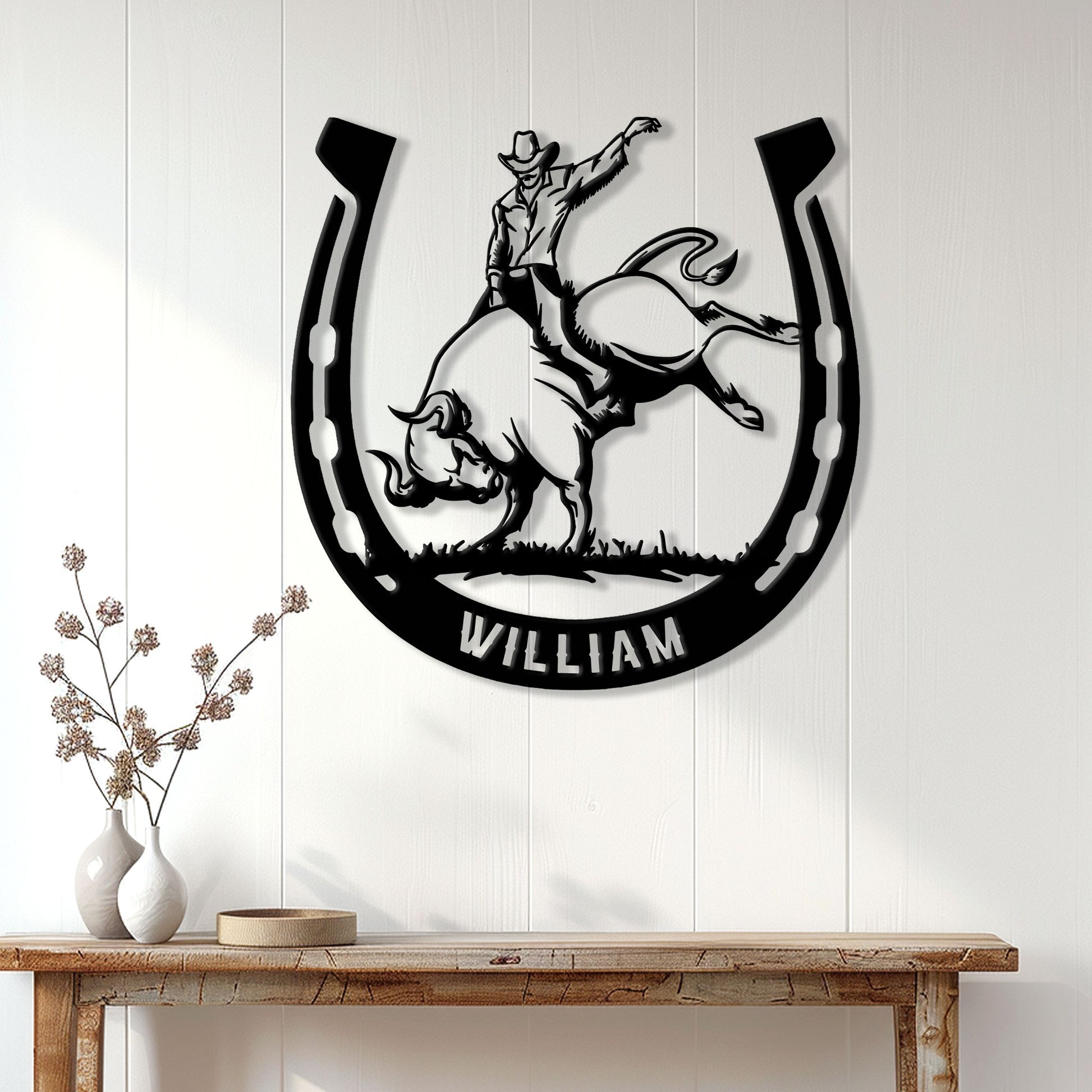 Rodeo wall decor featuring a cowboy riding a bucking bull in a horseshoe design
