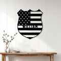American flag-inspired police badge sign displayed on a bright entryway wall