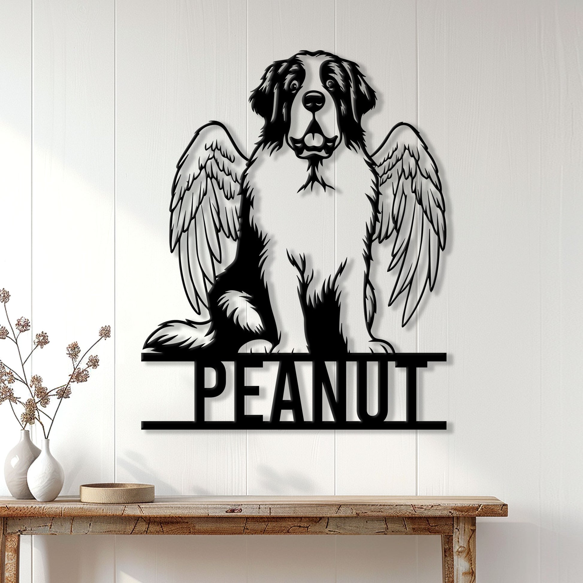 Saint Bernard angel dog metal wall decor displayed on a light wood-paneled entryway wall