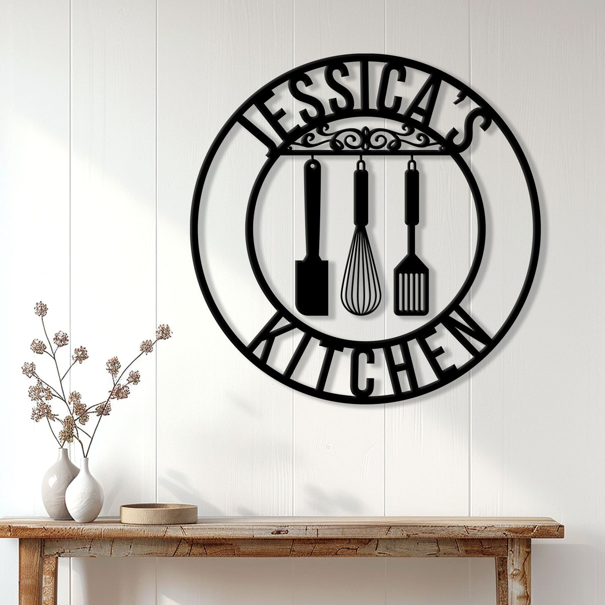 Kitchen utensil metal wall sign displayed above a rustic console table in a bright home interior