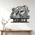 Sea turtle metal wall sign displayed on a light wood wall above a console table in a coastal home