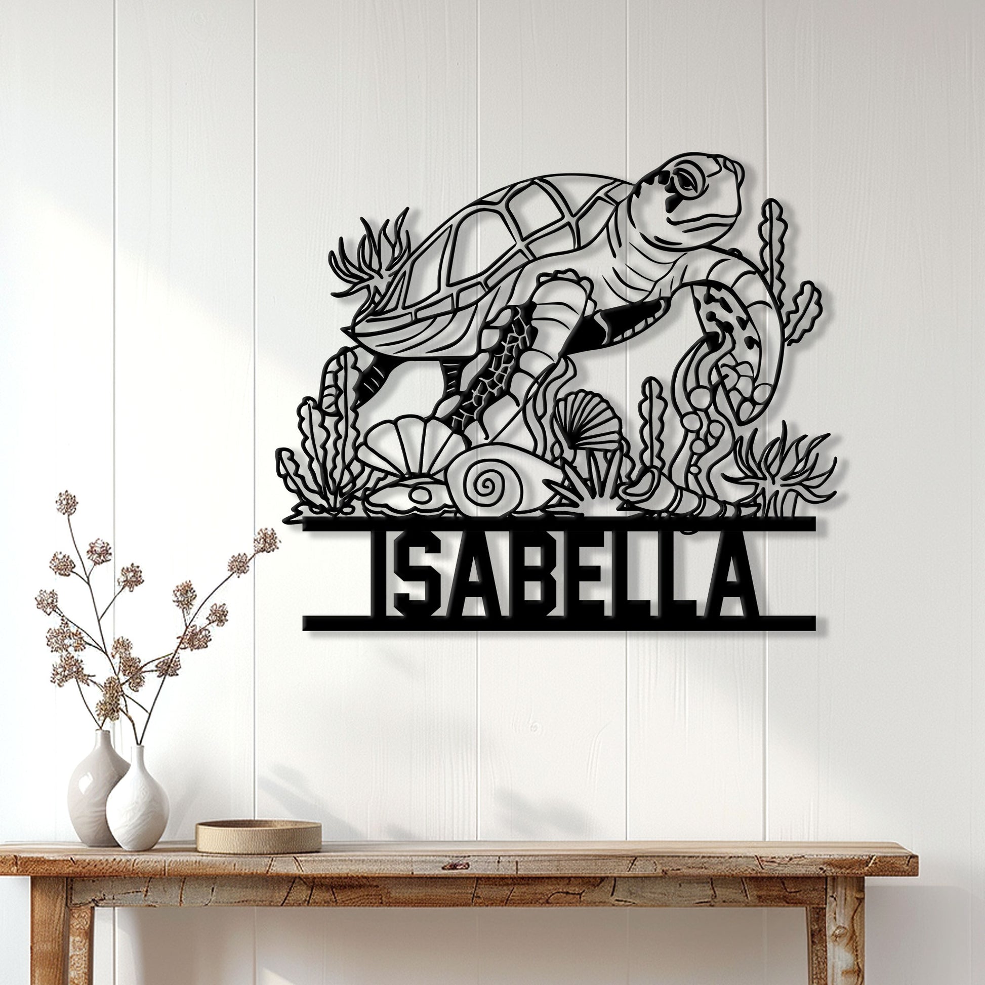 Sea turtle metal wall sign displayed on a light wood wall above a console table in a coastal home